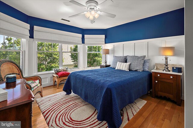 30558 Luff Ln Unit C-14, Ocean View, DE 19970 - bedroom with a decorative wall, light wood-style floors, and ceiling fan