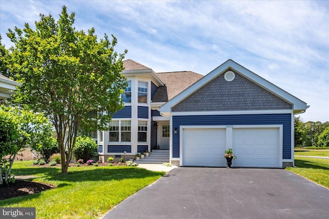 30558 Luff Ln Unit C-14, Ocean View, DE 19970 - view of front of home with asphalt driveway, a garage, a front lawn, and a shingled roof
