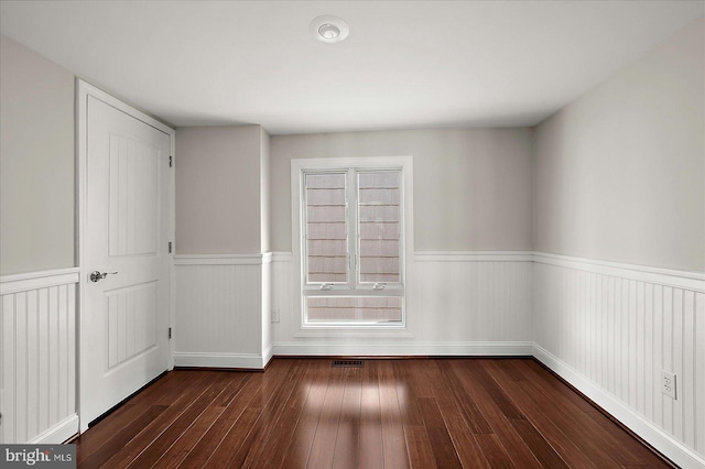 3 129th St Unit 7, Ocean City, MD 21842 - unfurnished bedroom with wainscoting and hardwood / wood-style flooring