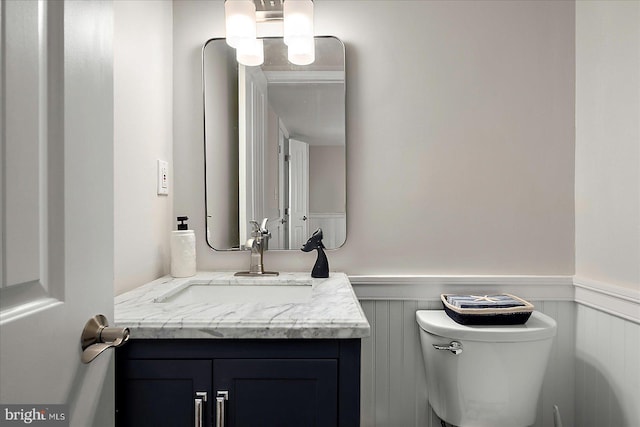 3 129th St Unit 7, Ocean City, MD 21842 - half bathroom featuring a wainscoted wall, vanity, and toilet