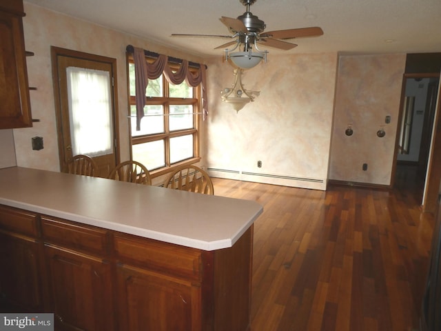 2358 Atco Ave, Atco, NJ 08004 - kitchen featuring baseboard heating, a ceiling fan, a peninsula, dark wood finished floors, and light countertops