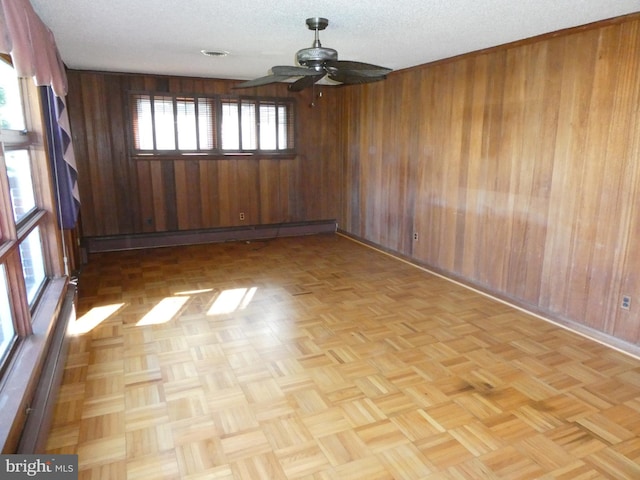 2358 Atco Ave, Atco, NJ 08004 - empty room with wooden walls, ceiling fan, a baseboard heating unit, and baseboards