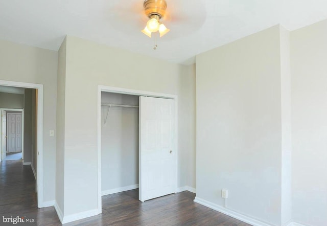 4825 3rd St NW, Washington, DC 20011 - unfurnished bedroom with dark wood-style flooring and a closet