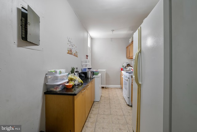 4825 3rd St NW, Washington, DC 20011 - kitchen with white range with gas cooktop, dark countertops, radiator heating unit, and electric panel