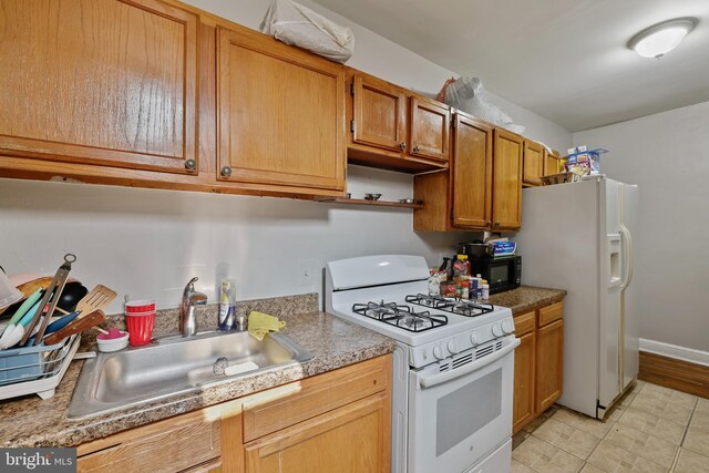 4825 3rd St NW, Washington, DC 20011 - kitchen with white appliances, brown cabinets, open shelves, light tile patterned flooring, and light countertops