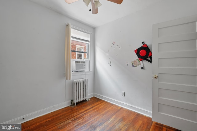 4825 3rd St NW, Washington, DC 20011 - spare room featuring radiator, ceiling fan, wood finished floors, and cooling unit