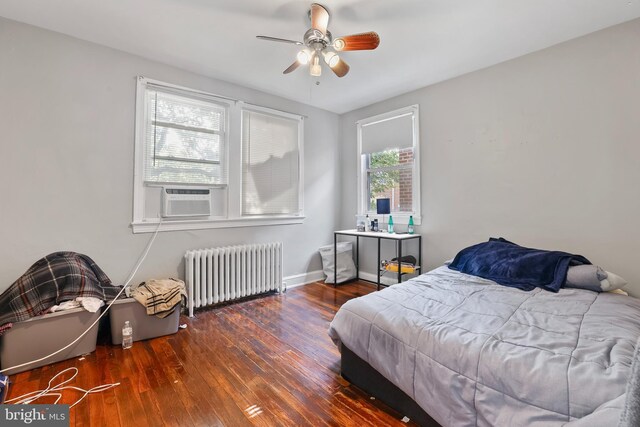 4825 3rd St NW, Washington, DC 20011 - bedroom featuring radiator, cooling unit, hardwood / wood-style flooring, and a ceiling fan