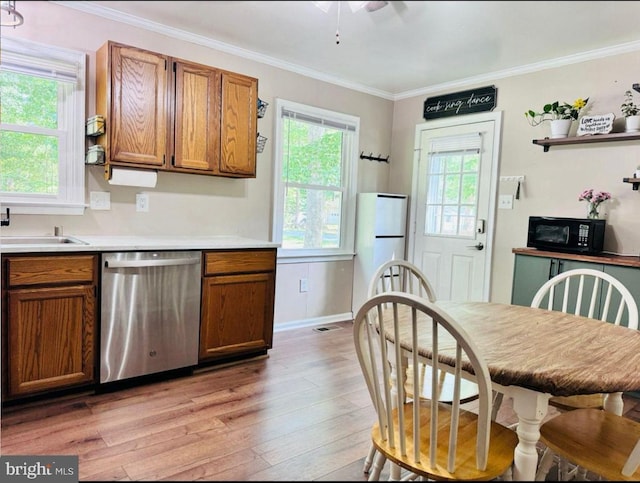 608 Tacketts Mill Rd, Stafford, VA 22556 - kitchen featuring dishwasher, black microwave, light wood finished floors, brown cabinets, and crown molding
