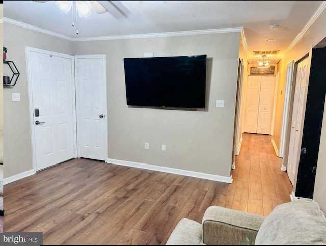 608 Tacketts Mill Rd, Stafford, VA 22556 - unfurnished living room featuring wood finished floors, baseboards, a ceiling fan, and crown molding