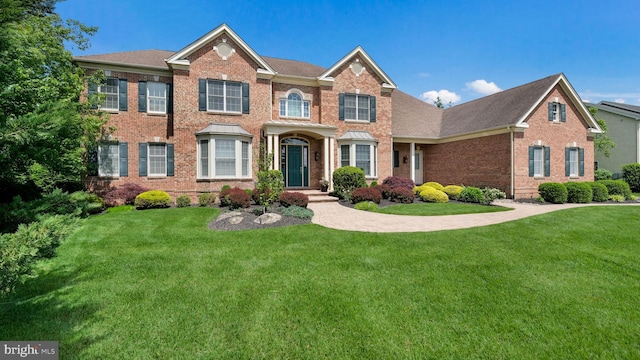 2799 Manion Way, Doylestown, PA 18902 - colonial inspired home featuring brick siding, a front lawn, and roof with shingles