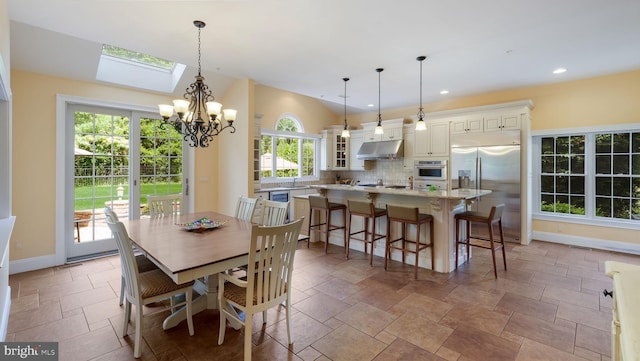 2799 Manion Way, Doylestown, PA 18902 - dining area with stone tile flooring, a skylight, a chandelier, and recessed lighting
