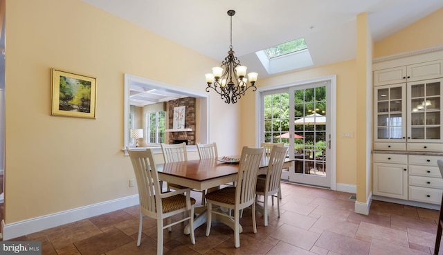 2799 Manion Way, Doylestown, PA 18902 - dining room featuring a chandelier, a skylight, vaulted ceiling, and stone tile flooring