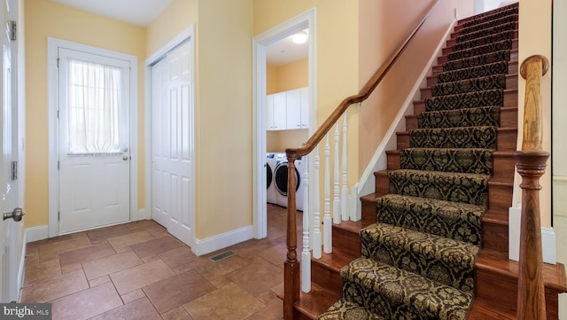 2799 Manion Way, Doylestown, PA 18902 - foyer with washer and clothes dryer, stairs, and stone finish floors