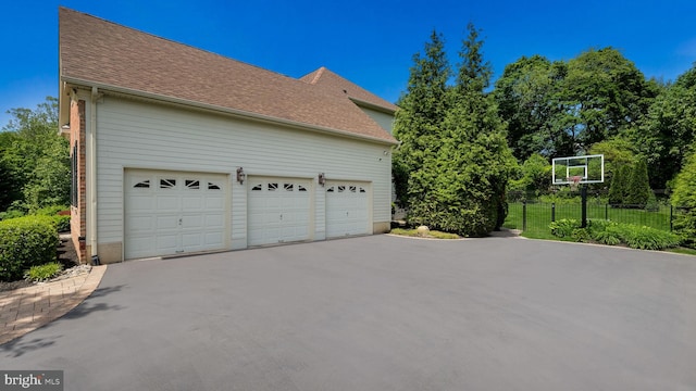 2799 Manion Way, Doylestown, PA 18902 - view of side of property featuring driveway, a shingled roof, and a garage