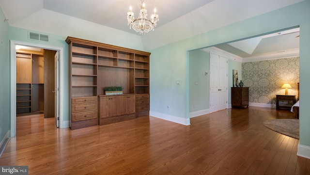 2799 Manion Way, Doylestown, PA 18902 - unfurnished living room featuring wallpapered walls, a chandelier, and wood finished floors
