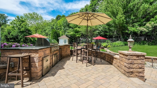 2799 Manion Way, Doylestown, PA 18902 - view of patio with exterior kitchen, view of wooded area, and outdoor dining area