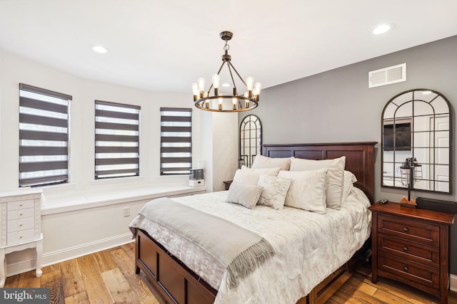 2305 S Croskey St, Philadelphia, PA 19145 - bedroom featuring light wood-style flooring, a chandelier, recessed lighting, and baseboards