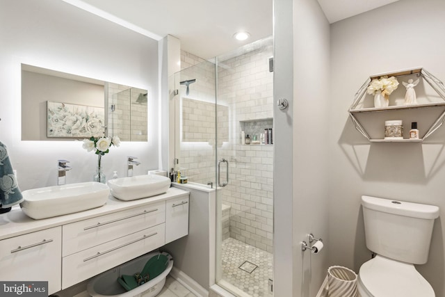 2305 S Croskey St, Philadelphia, PA 19145 - full bathroom featuring double vanity, a shower stall, toilet, and recessed lighting