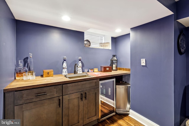 2305 S Croskey St, Philadelphia, PA 19145 - indoor wet bar featuring dark wood-style floors, baseboards, and recessed lighting