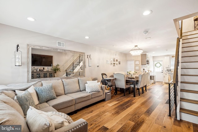2305 S Croskey St, Philadelphia, PA 19145 - living room with stairs, light wood finished floors, recessed lighting, and a chandelier