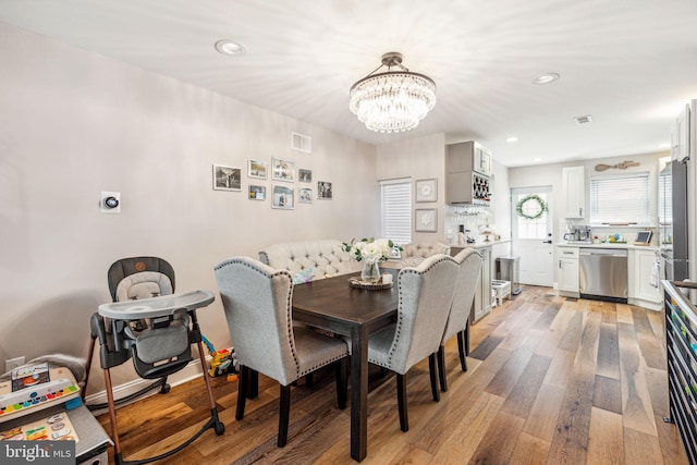 2305 S Croskey St, Philadelphia, PA 19145 - dining area with a chandelier, light wood-style flooring, and recessed lighting