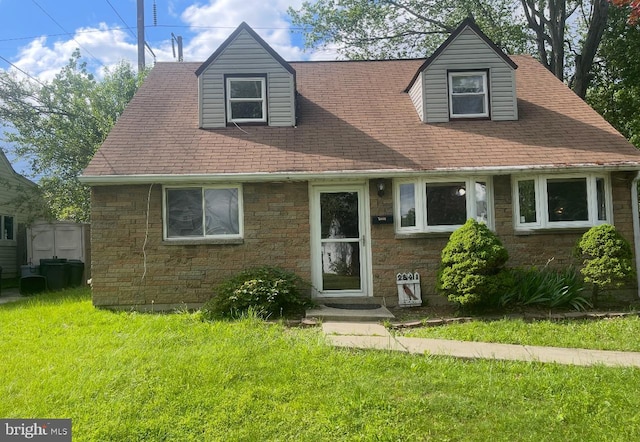 2541 Secane Rd, Secane, PA 19018 - view of front of home featuring a front lawn, stone siding, and a shingled roof