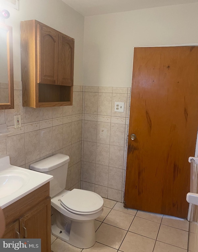 2541 Secane Rd, Secane, PA 19018 - bathroom featuring tile walls, tile patterned floors, toilet, and vanity