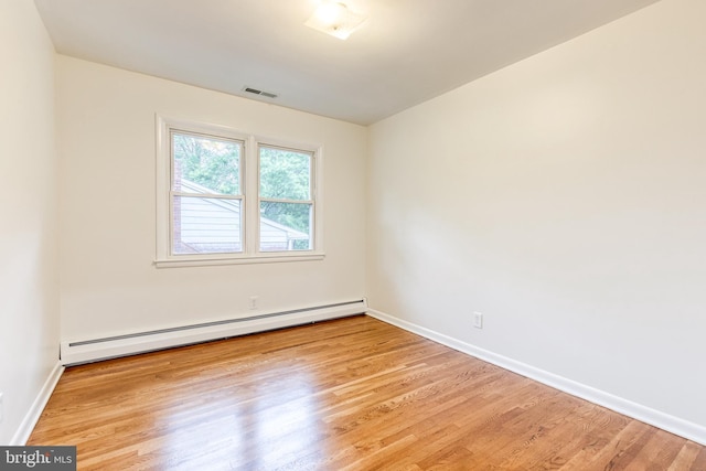 522 Goucher Blvd, Baltimore, MD 21286 - unfurnished room with baseboard heating, wood finished floors, and baseboards