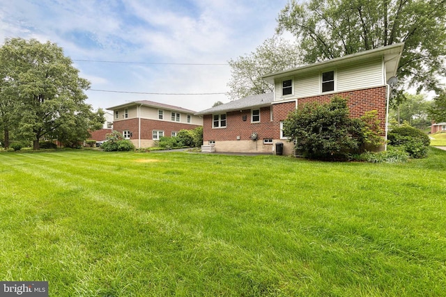 522 Goucher Blvd, Baltimore, MD 21286 - back of house featuring brick siding, a yard, and a patio area