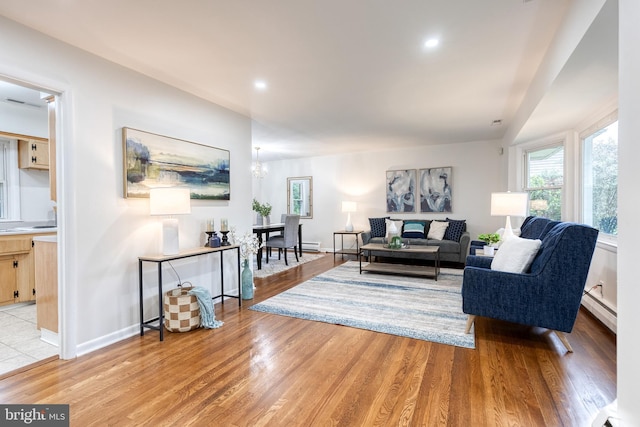 522 Goucher Blvd, Baltimore, MD 21286 - living area featuring baseboard heating, light wood-style flooring, recessed lighting, and baseboards