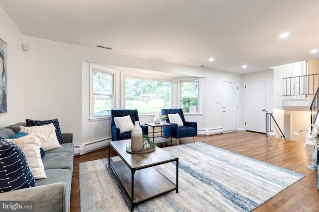 522 Goucher Blvd, Baltimore, MD 21286 - living room with a baseboard radiator, wood finished floors, recessed lighting, stairway, and baseboards