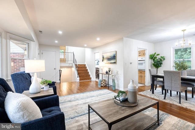 522 Goucher Blvd, Baltimore, MD 21286 - living area with stairway, wood finished floors, a chandelier, baseboards, and recessed lighting