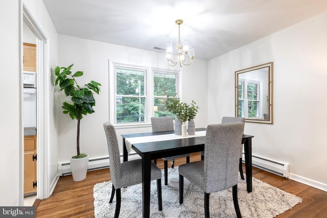 522 Goucher Blvd, Baltimore, MD 21286 - dining area featuring baseboard heating, a chandelier, wood finished floors, and baseboards