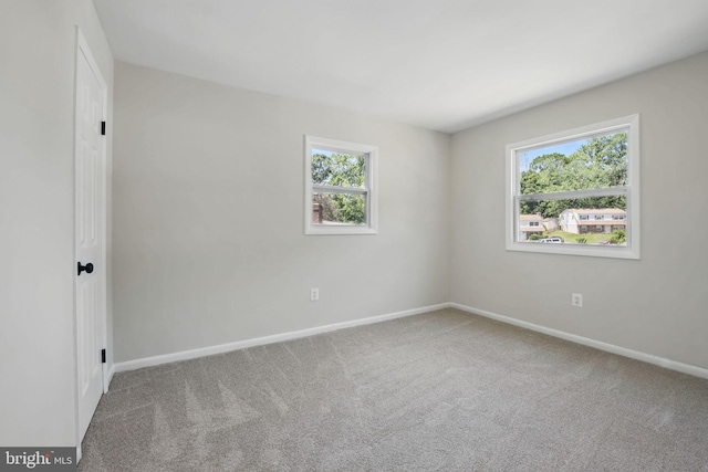 13798 Gresham Ct, Woodbridge, VA 22193 - carpeted empty room featuring plenty of natural light and baseboards