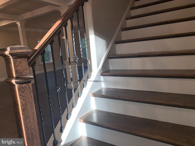 stairs featuring baseboards and ornate columns