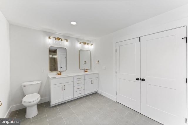 full bathroom featuring baseboards, toilet, double vanity, tile patterned floors, and recessed lighting