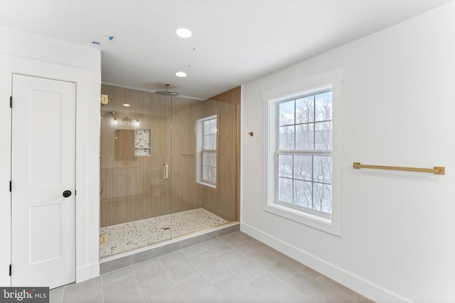 bathroom featuring tile patterned floors, a shower stall, baseboards, and recessed lighting