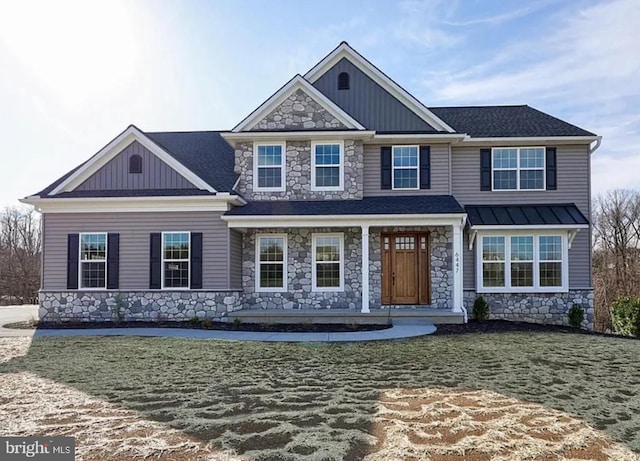 view of front of property with stone siding, board and batten siding, a porch, and a shingled roof