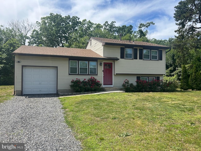 1258 W Cornell St, Vineland, NJ 08360 - split level home with an attached garage, gravel driveway, and a front yard