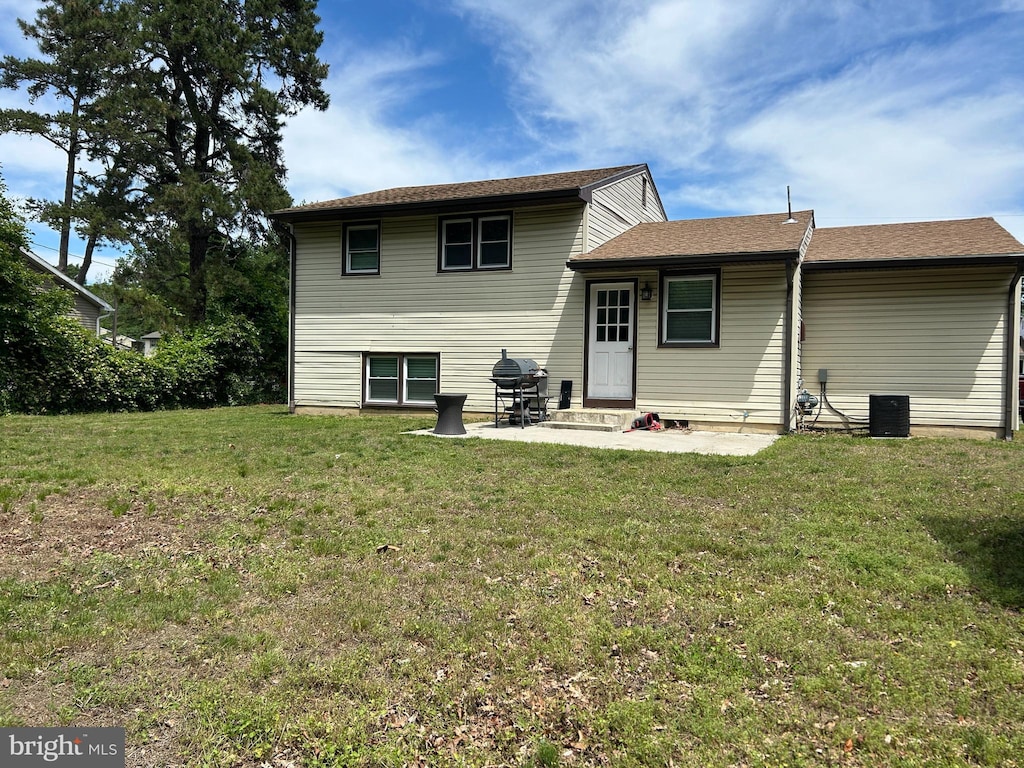 1258 W Cornell St, Vineland, NJ 08360 - rear view of property with a yard and a patio