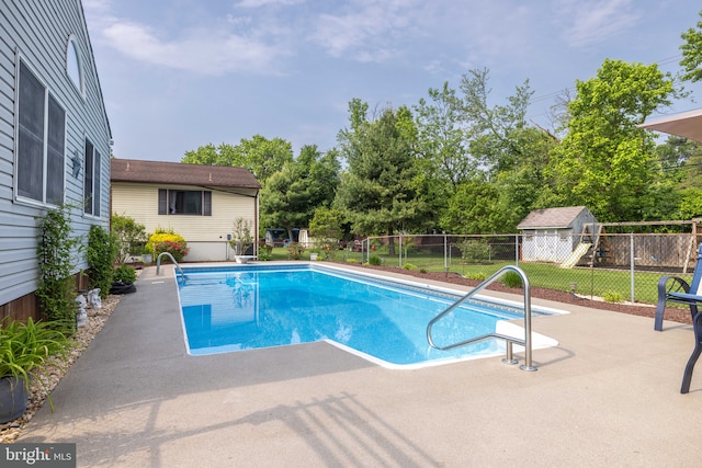 13 Berley Ct, Newark, DE 19702 - view of pool featuring a patio area, a playground, and view of scattered trees