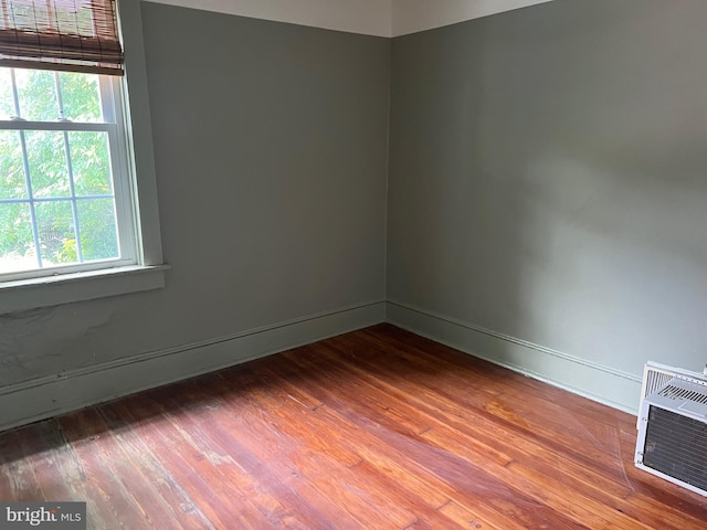 303 Johnson Ave, Upper Chichester, PA 19061 - spare room featuring wood finished floors, baseboards, and heating unit