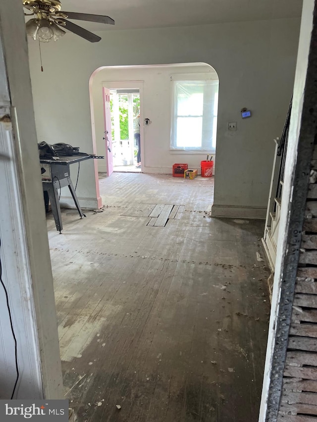 303 Johnson Ave, Upper Chichester, PA 19061 - unfurnished living room with arched walkways, wood-type flooring, and ceiling fan