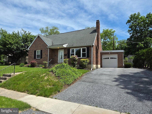 616 Sylvan Pl, Harrisburg, PA 17109 - view of front of property featuring brick siding, a chimney, a front yard, and asphalt driveway