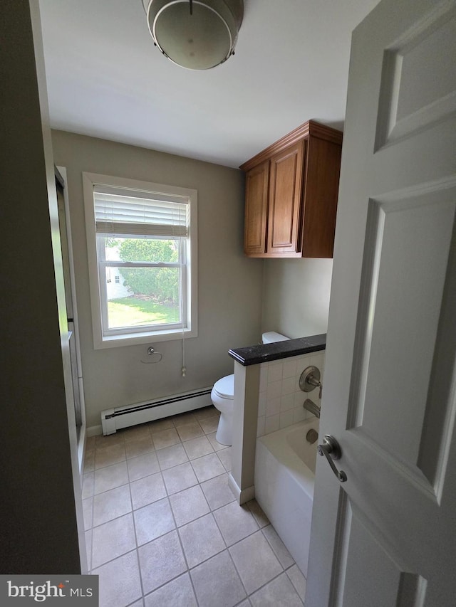 616 Sylvan Pl, Harrisburg, PA 17109 - laundry area with a baseboard radiator and light tile patterned flooring