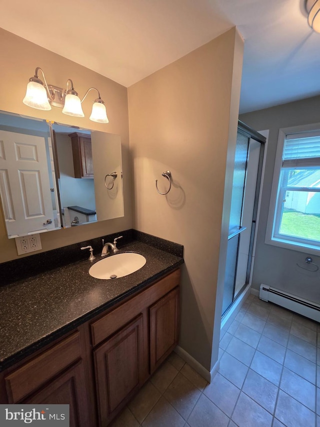616 Sylvan Pl, Harrisburg, PA 17109 - full bathroom with a shower stall, vanity, tile patterned flooring, baseboards, and a baseboard heating unit