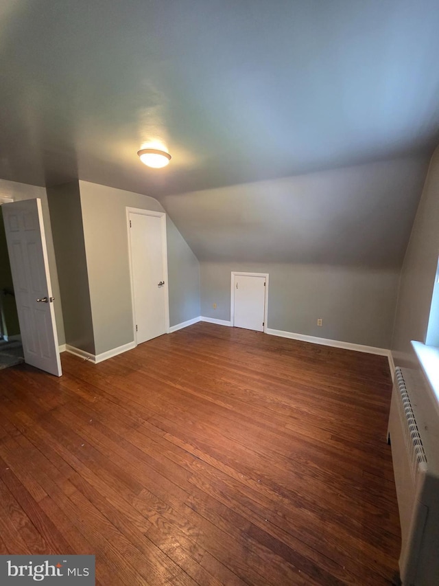 616 Sylvan Pl, Harrisburg, PA 17109 - bonus room with vaulted ceiling, dark wood finished floors, and baseboards
