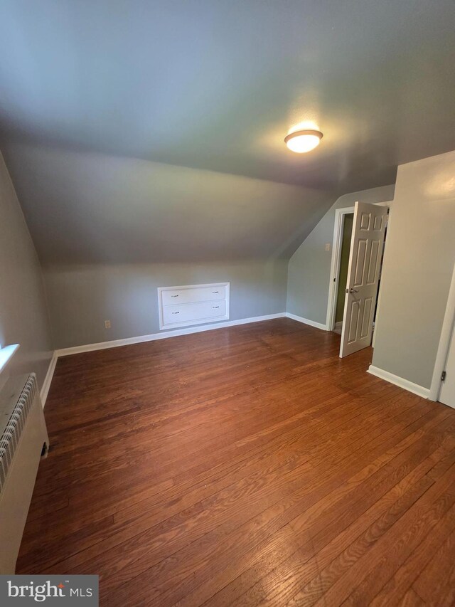 616 Sylvan Pl, Harrisburg, PA 17109 - bonus room featuring lofted ceiling, wood finished floors, baseboards, and radiator heating unit