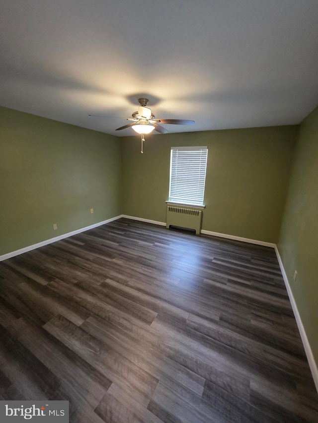 616 Sylvan Pl, Harrisburg, PA 17109 - unfurnished room with radiator, a ceiling fan, baseboards, and dark wood-style floors