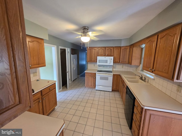 616 Sylvan Pl, Harrisburg, PA 17109 - kitchen featuring white appliances, a sink, decorative backsplash, brown cabinets, and a ceiling fan